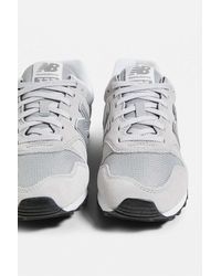 new balance 840 white and silver trainers