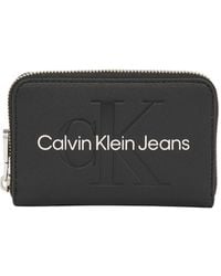 Calvin Klein - Sculpted Zip Around Purse - Lyst