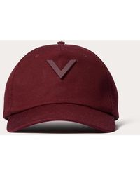 Valentino Garavani - Cappello baseball v detail in cotone con applicazione v in metallo - Lyst