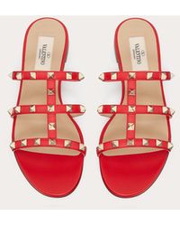 Valentino Valentino Garavani sandalias planas de pala rockstud - Multicolor