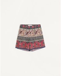 Valentino - Cotton Muslin Bermuda Shorts With Voyage Imaginaire Print And Passementerie Trim - Lyst