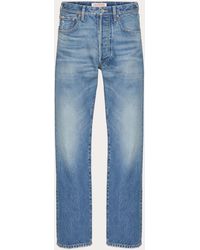 Valentino - Denim Trousers With Metallic V Detail - Lyst