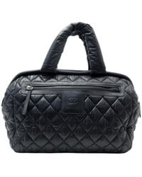 Chanel Bolso de viaje Coco Cocoon de Lona - Negro