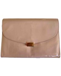 neon pink patent clutch bag