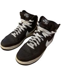 brown high top nikes