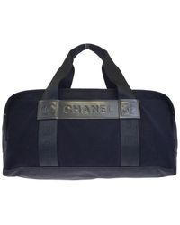 Chanel Bolsos de viaje en lona negro