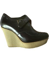 Sandro Bottines & low boots à compensés cuir marron