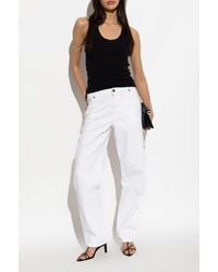 Matteau - Jeans With Logo Appliqué - Lyst