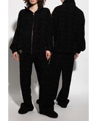 Versace - Pants With Logo - Lyst
