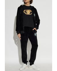 Versace - Velvet Trousers With A Shimmering Appliqué - Lyst
