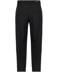 Versace - Wool Pleated Trousers - Lyst