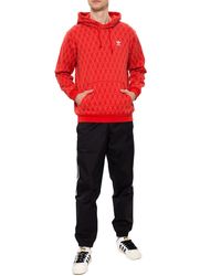 red and black adidas jumper