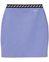 Versace - Short Skirt With Embroidered Logo - Lyst