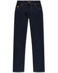 Versace - Tapered Leg Jeans - Lyst