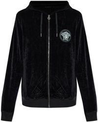 Versace - Velvet Trousers With A Shimmering Appliqué - Lyst