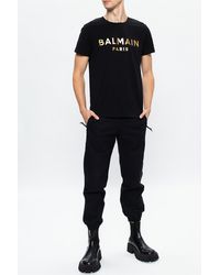 Balmain T-shirt bianca in cotone con logo Balmain Paris dorato Bianco | T-Shirt  Uomo « Melisaramet