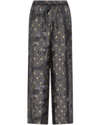 Ganni - Loose-Fit Silk Trousers - Lyst