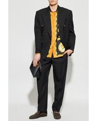 Versace - Wool Pleated Trousers - Lyst