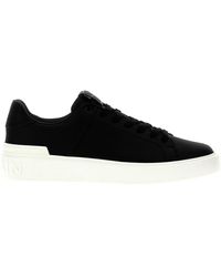 Balmain - Sneaker con logo patch nero e bianco - Lyst
