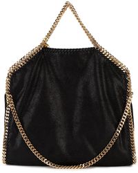 Stella McCartney - Borsa Tote Falabella Fold Over Nera e Oro - Lyst