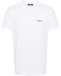 Balmain - T-shirt con applicazione logo - Lyst