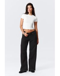 Weekday - Oblique Low Waist Loose Barrel Leg Jeans - Lyst