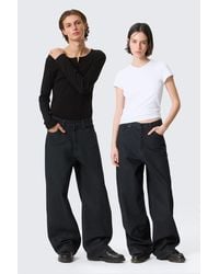 Weekday - Astro Mid Rise Loose Baggy Coated Jeans - Lyst