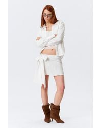 Monki - Low Rise Bow Detail Mini Wrap Skirt - Lyst