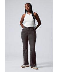 Weekday - Glow Curve High Flared Jeans - Lyst
