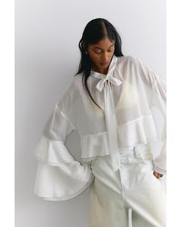Monki - Flared Frill-Sleeved Tie-Neck Blouse - Lyst