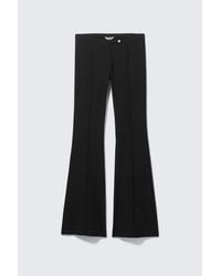 Monki - Low Rise Skinny Flared Leg Trousers - Lyst