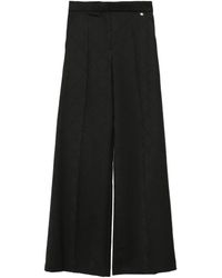 Nissa - Logo-Print Wool Pants - Lyst