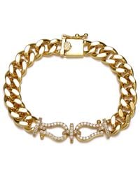 Genevive Jewelry - Rachel Glauber Plated With Cubic Zirconia Love Knot Miami Cuban-Curb Chain Bracelet - Lyst