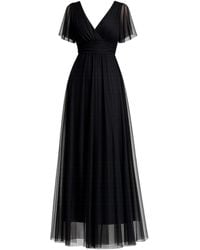 Tantra Spain Sl - Long Tulle Dress With Short Seeves, Pleats, And A Flared Skirt, With A Tie Belt - Lyst