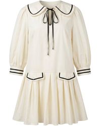 Modenaire - Neutrals Long Sleeve Mini Dress With Peter Pan Collar Front Tie Detail Contrast Trim Pockets And Soft Pleated Skirt - Lyst