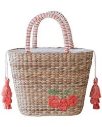 LIKHÂ - Neutrals Handwoven Seagrass Tomato Tote Bag With Tassels - Lyst