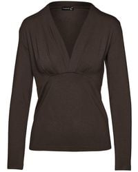 Conquista - Long Sleeve Faux Wrap Top - Lyst