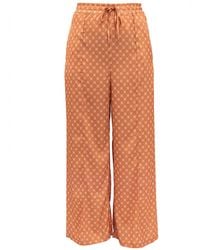 Janara Jones - Apricot Satin Trousers - Lyst