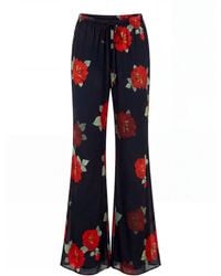 concept A trois - Chiffon Flared Pants With Rose Print - Lyst