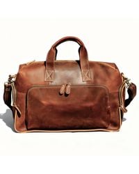 Touri - Genuine Leather Front Pockets Boarding Bag - Lyst