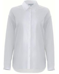 Solgo Atelier - Solgo Long Sleeve Cotton Button-Up Shirt With Hi-Low Hemline And Contrast Collar Button Detail - Lyst