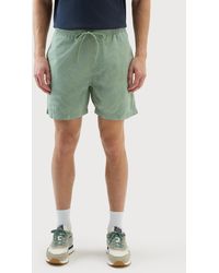 Woolrich - Pure Cotton Garment-dyed Shorts With A Tropical Print - Lyst
