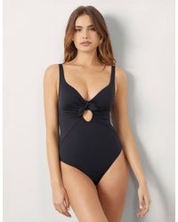 Yamamay - Costume nero intero coppe leggermente imbottite con fiocco Essentials - Lyst