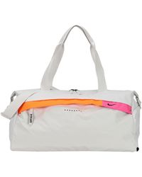 bolsos nike hombre dorados