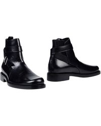 Balenciaga stivali texani con punta e tallone in metallo - Stileo.it