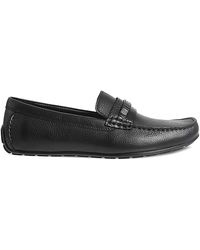Calvin Klein Zapatos sin cordones marr\u00f3n-negro letras impresas look casual Zapatos Flats Zapatos sin cordones 