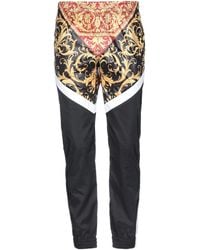versace stretch pants