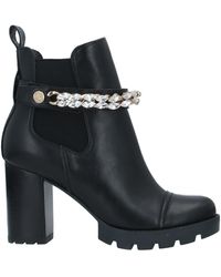 Botines Guess de mujer: hasta el 57 % de descuento | Lyst