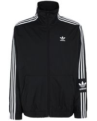 sudadera adidas blanca con rayas negras