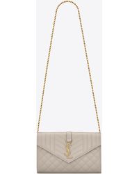 monogram saint laurent chain wallet in black grain de poudre textured matelassé leather